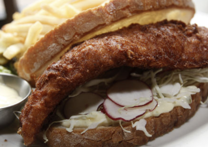 The Old Fashioned signature dishes Walleye SandwichWisconsin Beer Cheese SoupDoor County Cherry Salad